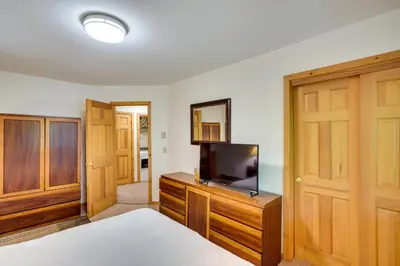 a bedroom with a bed and a tv on a dresser at Fantastic 2 family vacation home with EV charger in Windham