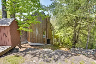 a wooden building in the middle of the woods at Fantastic 2 family vacation home with EV charger in Windham