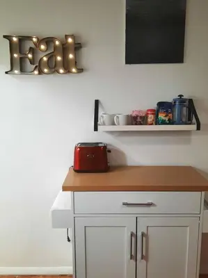 a kitchen with a counter with a red appliance on it at Pet Friendly Apartment minutes from NYC! in West New York
