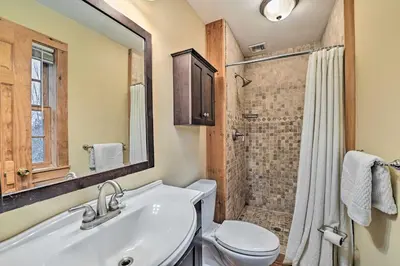 a bathroom with a toilet and a sink and a shower at West Dover Home with Deck about 2 Mi to Mount Snow! in West Dover