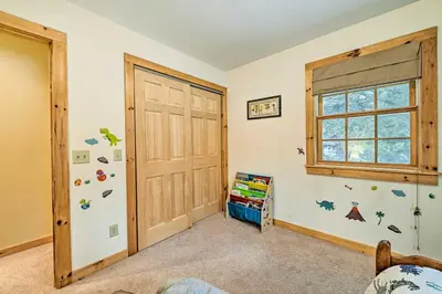 a room with a wooden door and a window at West Dover Home with Deck about 2 Mi to Mount Snow! in West Dover