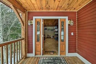 a front door of a home with a wooden ceiling at West Dover Home with Deck about 2 Mi to Mount Snow! in West Dover