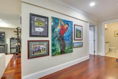 a room with four paintings on a wall at Hudson River Views Briarcliff Manor Home with Deck in Briarcliff Manor