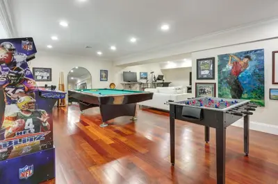 a living room with a ping pong table and games at Hudson River Views Briarcliff Manor Home with Deck in Briarcliff Manor