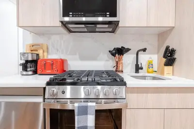 a kitchen with a stove and a microwave at 323-1 Specious 2BR Williamsburg in Brooklyn