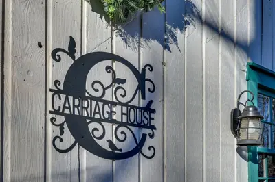 a sign on the side of a building at Guilford Carriage House at Granite Lodge! in Guilford
