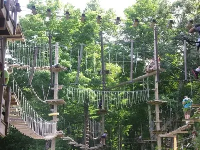 a playground in a park with people on it at WOW-New Ski OnOff Suite By Pool Sleeps 4 Jiminy Pk in Hancock
