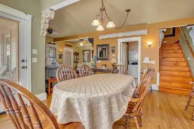 a dining room with a table and chairs at A Bonnie Place in Oneonta