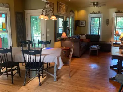 a living room with a table and a couch at A Bonnie Place in Oneonta