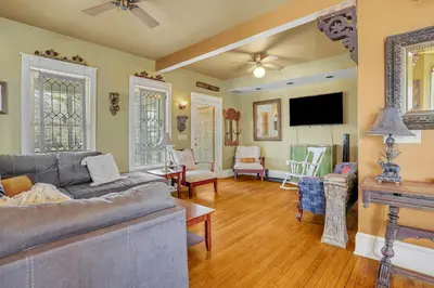 a living room with a couch and a tv at A Bonnie Place in Oneonta