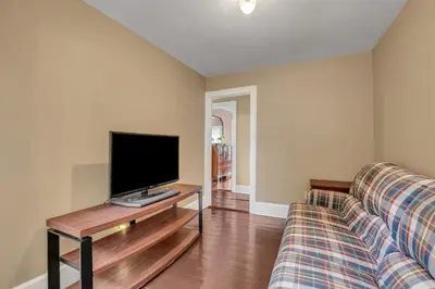 a living room with a tv and a couch at Doyle House - Near Cooperstown Dreams Park 2 in Milford