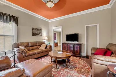 a living room with leather furniture and a tv at Doyle House - Near Cooperstown Dreams Park 2 in Milford