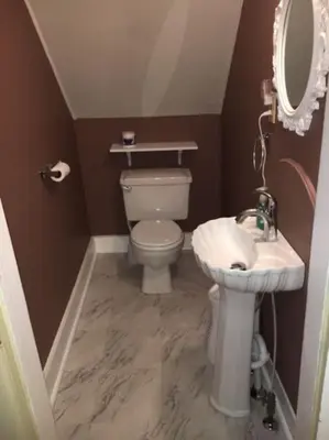 a small bathroom with a toilet and a sink at Doyle House - Near Cooperstown Dreams Park 2 in Milford