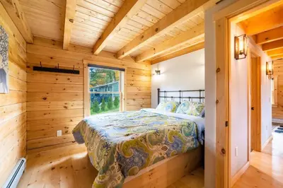 a bedroom with a bed in a log cabin at Florida Mountain Log Cabin in Florida