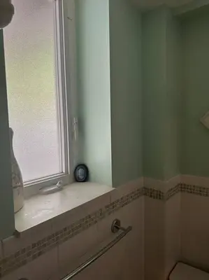 a bathroom with a window and a sink at Morris Park area(very close to Jacobi Hospital in Morris Park