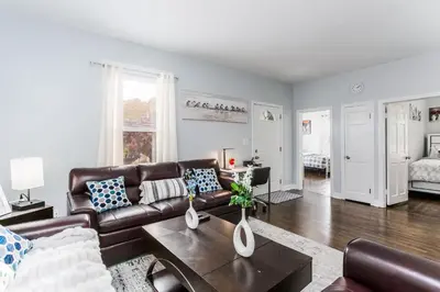 a living room with a couch and a table at 2 Bedroom Apartment Near Bristol Center in Bristol