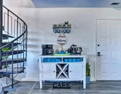 a kitchen with a white counter and a staircase at Great Gorge-ous condo in Vernon Township