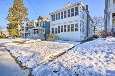 a house with snow in front of it at Charming Albany Retreat about 3 Mi to Downtown! in Albany
