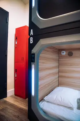 a bedroom with a bed with a tv on it at KAMA CENTRAL PARK in New York