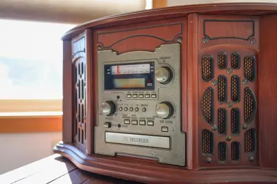 an old wooden radio sitting on top of a table at Luxury Spacious Home with some FREE Amenities and Activities! in Mushroom Farms