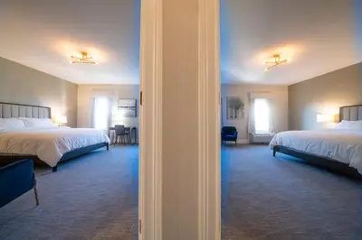 a view of a hotel room with two beds at Orange Inn Boutique Hotel in Goshen