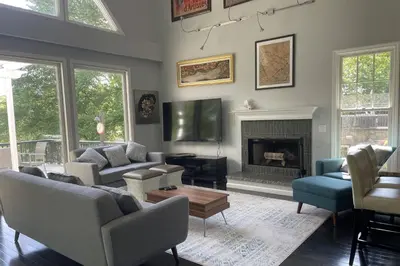 a living room with a couch and a fireplace at Cottage at Sunny Day in Newtown