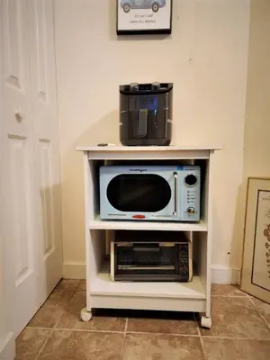 a microwave on a shelf in a kitchen with a appliance at Gorgeous 1st FL Mtn View Jiminy Suite Sleeps 4 Ski On Off in Hancock