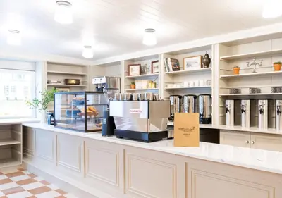 a counter in a store with a lot of shelves at Wylder Windham in Windham