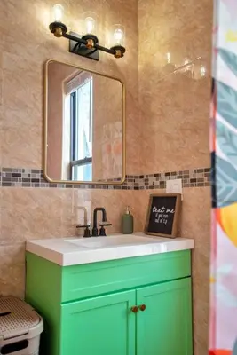 a bathroom with a green sink and a mirror at Peachy Paradise in East Rock Near DT/Yale in New Haven