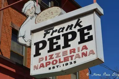 a sign for a pizza restaurant on the side of a building at Peachy Paradise in East Rock Near DT/Yale in New Haven