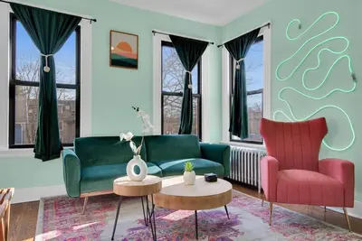 a living room with two chairs and a couch and a table at Green N' Groovy in the Heart of East Rock Near DT, Yale in New Haven