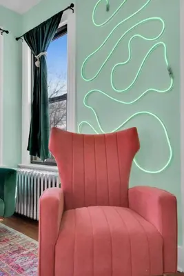 a red chair in a room with a window at Green N' Groovy in the Heart of East Rock Near DT, Yale in New Haven