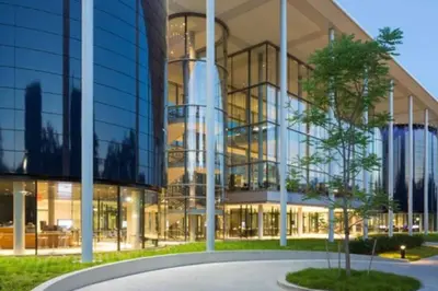 a large glass building with a tree in front of it at Green N' Groovy in the Heart of East Rock Near DT, Yale in New Haven