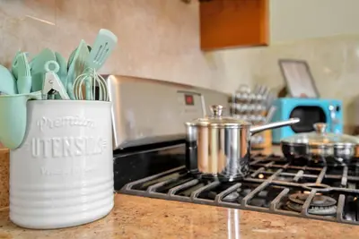a kitchen counter with a pot on a stove at Golden Gem in Heart of East Rock Quiet 3BR Near DT and Yale in New Haven