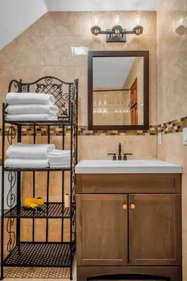 a bathroom with a sink and a mirror at Golden Gem in Heart of East Rock Quiet 3BR Near DT and Yale in New Haven