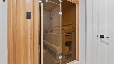 a glass door leading into a room with a closet at Forget-Me-Not by AvantStay Bold Lakefront Escape in Monterey