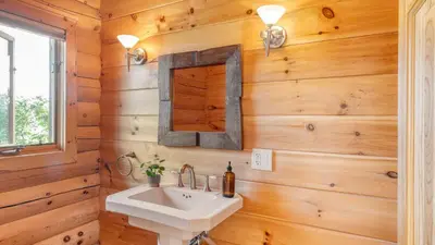 a bathroom with a sink and a mirror at Chester by AvantStay Amazing Views Secluded Home A True City Escape in Austerlitz