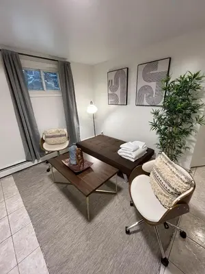 a living room with a table and chairs at Two Bedroom Private Apt near NYC in West New York
