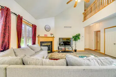 a living room with a couch and a fireplace at Game Room Poconos Family Home 13 Mi to Skiing! in Tobyhanna