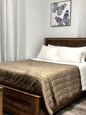 a bedroom with a bed with butterflies on the wall at Newly 5 Star 3 Beds 1 Bath ideal Short term rental in Schenectady