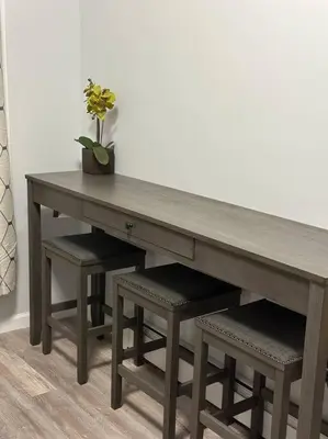 a wooden table with a potted plant sitting on top at Newly 5 Star 3 Beds 1 Bath ideal Short term rental in Schenectady