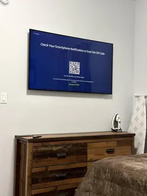 a flat screen tv hanging on a wall at Newly 5 Star 3 Beds 1 Bath ideal Short term rental in Schenectady