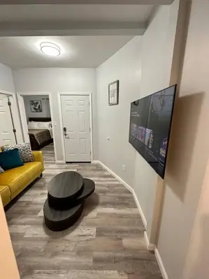 a living room with a couch and a table at Newly 5 Star 3 Beds 1 Bath ideal Short term rental in Schenectady