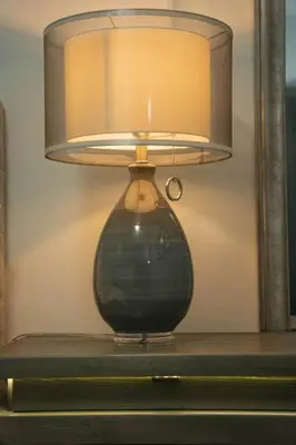 a lamp sitting on top of a table at Modern, Luxury 2 Bedroom Apt in Prime Location in Schenectady