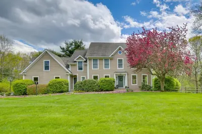 a large house with a green lawn at Pet-Friendly Beacon Area Vacation Rental 6 Acres in Lagrangeville