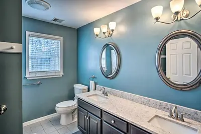 a bathroom with a sink and a toilet and a mirror at Pet-Friendly Beacon Area Vacation Rental 6 Acres in Lagrangeville