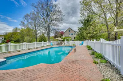 a swimming pool with a white fence at Pet-Friendly Beacon Area Vacation Rental 6 Acres in Lagrangeville