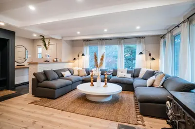 a living room with couches and a coffee table at Catskill MNTN Escape 5 BR 3 bath Villa Hot Tub Fire Pit Best Group Stay in Prattsville