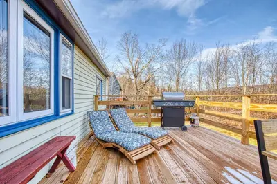 a patio with a bench and a grill on a deck at Catskills Cottage with Deck, 7 Mi to Hunter Mtn in Elka Park