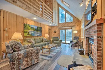 a living room with a couch and a fireplace at Relaxing Home Mins from Mt Snow, Hiking, and Lakes in Dover